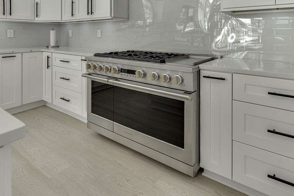 751 Rock Springs Road, Unit 2 Lawrenceville, GA 30043 - Photo 22 of 76 a stove top oven sitting inside of a kitchen