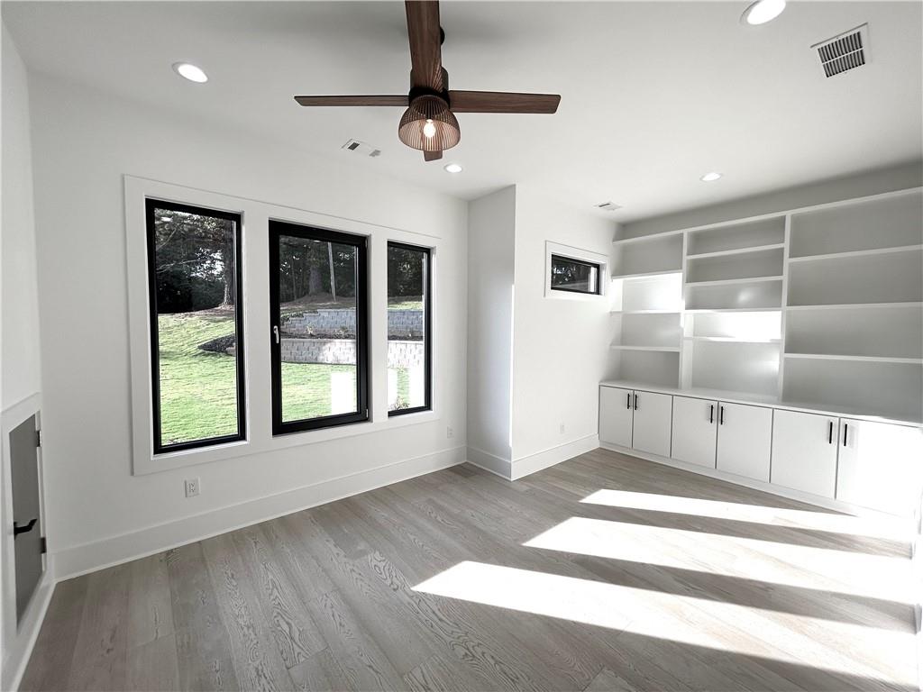 751 Rock Springs Road, Unit 2 Lawrenceville, GA 30043 - Photo 26 of 76 a view of an empty room with a window and a kitchen