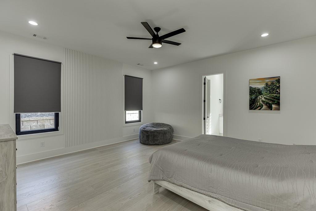 751 Rock Springs Road, Unit 2 Lawrenceville, GA 30043 - Photo 29 of 76 a bedroom with a bed and a ceiling fan