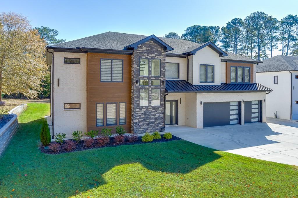 751 Rock Springs Road, Unit 2 Lawrenceville, GA 30043 - Photo 3 of 76 a front view of a house with a garden and yard
