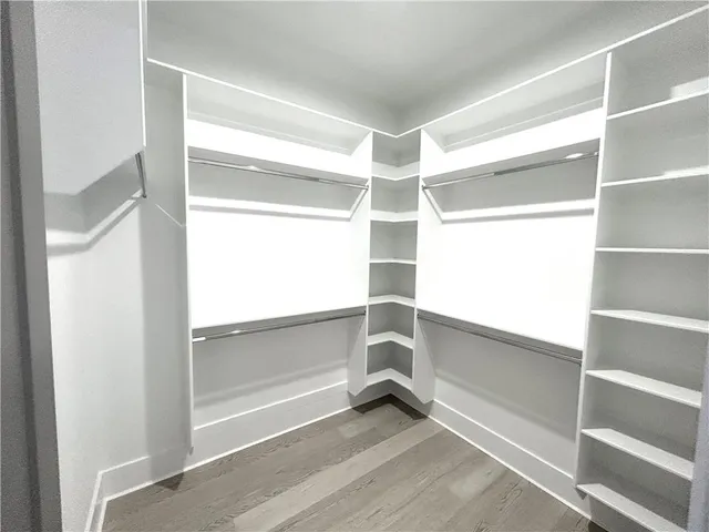 a view of livingroom with hardwood floor and a ceiling fan