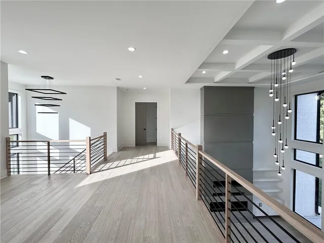 a kitchen with white cabinets and sink