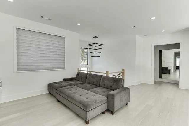 a view of livingroom with hardwood floor and a ceiling fan