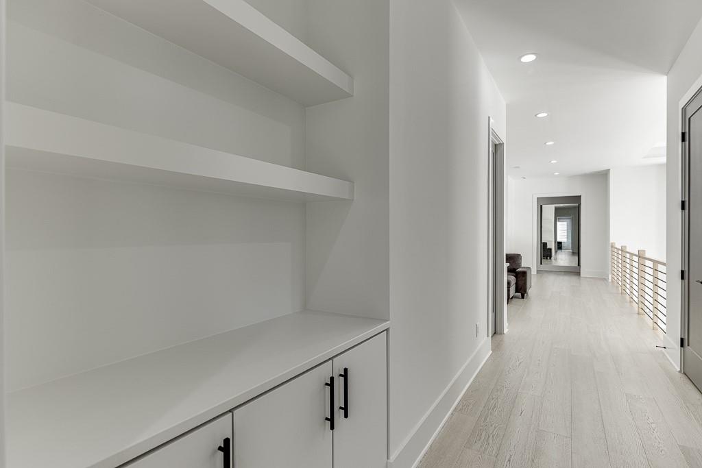 751 Rock Springs Road, Unit 2 Lawrenceville, GA 30043 - Photo 39 of 76 a view of a hallway with wooden floor and a living room