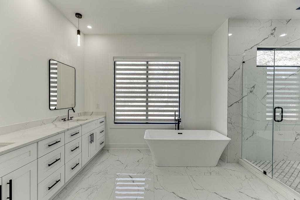 751 Rock Springs Road, Unit 2 Lawrenceville, GA 30043 - Photo 42 of 76 a bathroom with a bathtub and a sink