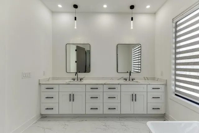 a view of a field with trees in the background