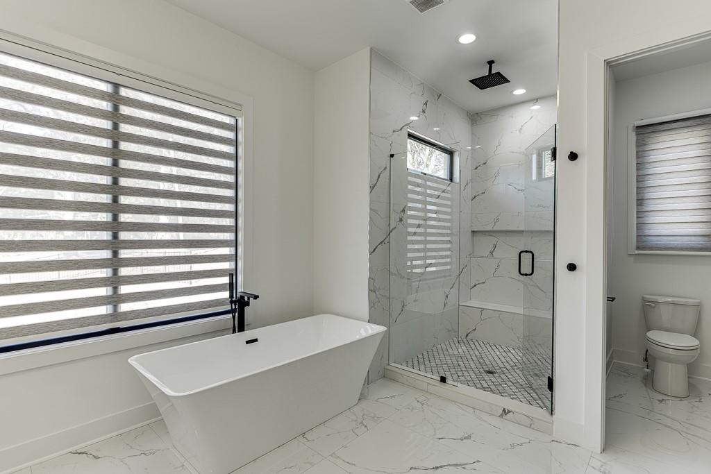751 Rock Springs Road, Unit 2 Lawrenceville, GA 30043 - Photo 44 of 76 a bathroom with a bathtub and a shower