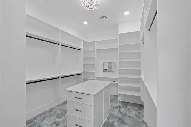 a front view of a house with a yard and a garage