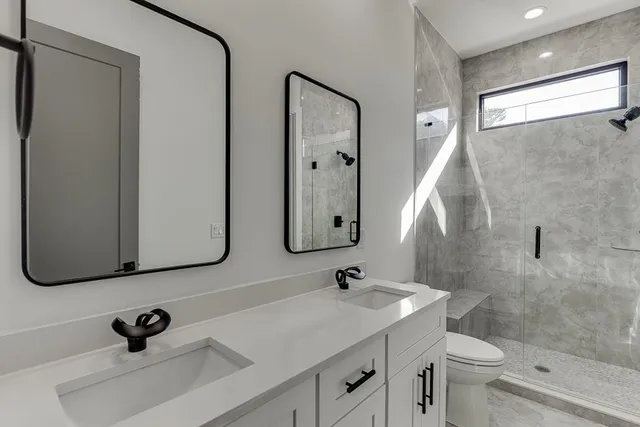 an aerial view of a house with garden space and outdoor seating