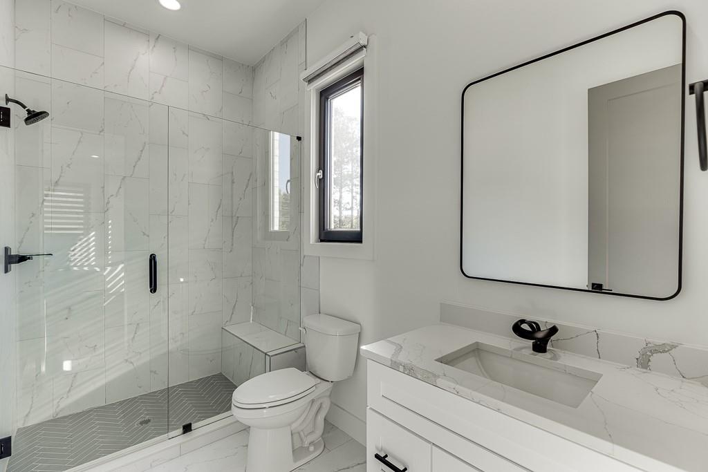 751 Rock Springs Road, Unit 2 Lawrenceville, GA 30043 - Photo 49 of 76 a bathroom with a sink a toilet and shower
