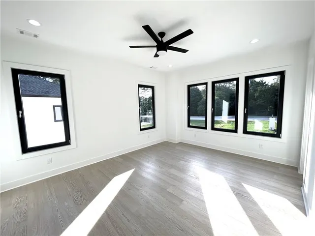 an aerial view of a house with a yard swimming pool and outdoor seating