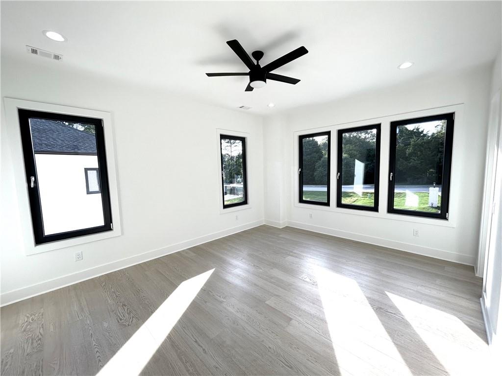 751 Rock Springs Road, Unit 2 Lawrenceville, GA 30043 - Photo 50 of 76 a view of livingroom with hardwood floor and a ceiling fan
