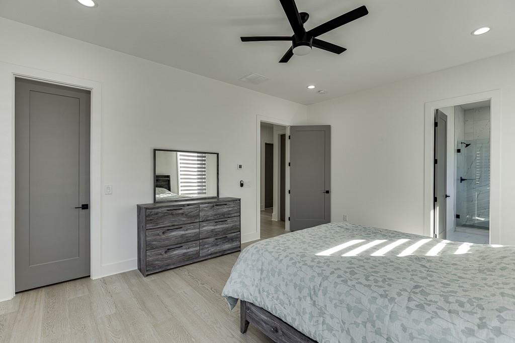 751 Rock Springs Road, Unit 2 Lawrenceville, GA 30043 - Photo 51 of 76 a bedroom with a bed and a dresser