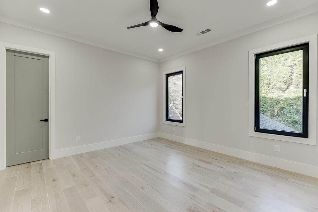 751 Rock Springs Road, Unit 2 Lawrenceville, GA 30043 - Photo 53 of 76 a view of an empty room with a window and wooden floor