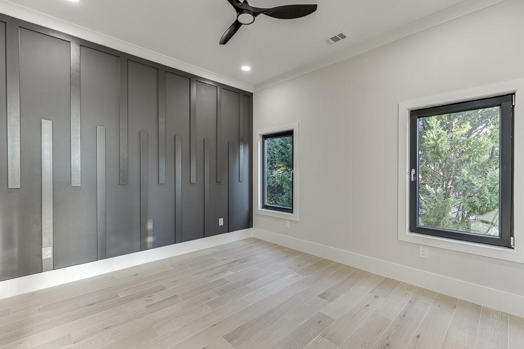 751 Rock Springs Road, Unit 2 Lawrenceville, GA 30043 - Photo 59 of 76 an empty room with windows ceiling fan and windows