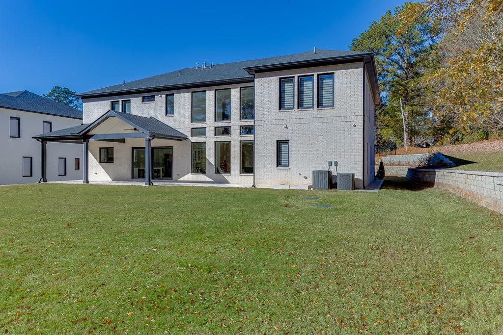 751 Rock Springs Road, Unit 2 Lawrenceville, GA 30043 - Photo 64 of 76 a front view of a house with a garden