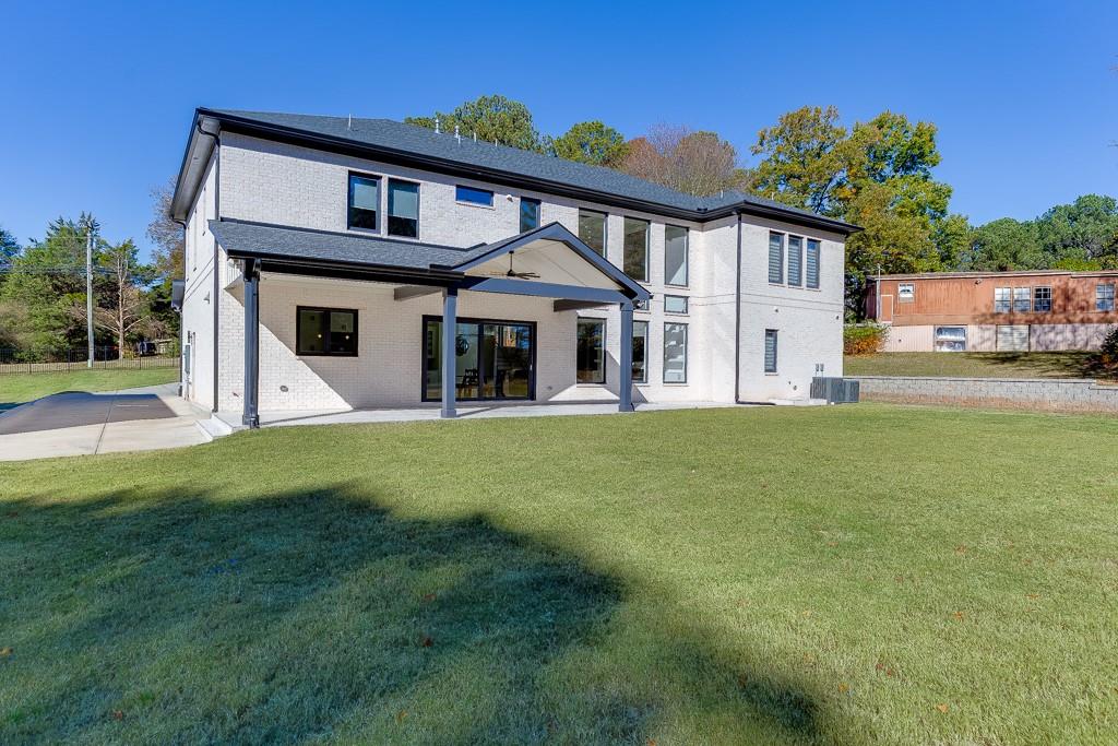 751 Rock Springs Road, Unit 2 Lawrenceville, GA 30043 - Photo 66 of 76 a front view of a house with a yard