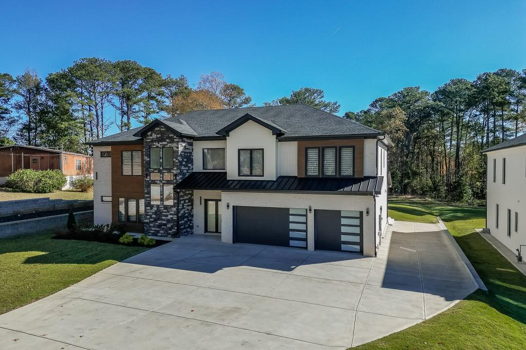 751 Rock Springs Road, Unit 2 Lawrenceville, GA 30043 - Photo 69 of 76 a front view of a house with a yard and a garage