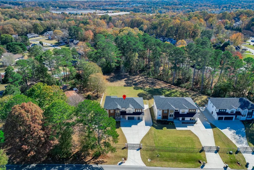 751 Rock Springs Road, Unit 2 Lawrenceville, GA 30043 - Photo 72 of 76 an aerial view of a house with garden space and outdoor seating