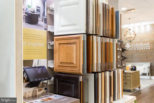 a kitchen with stainless steel appliances granite countertop a stove and cabinets