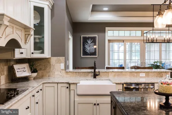 a close view of a sink and dishwasher in front of a cabinet