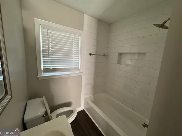 a bathroom with sink and bathtub
