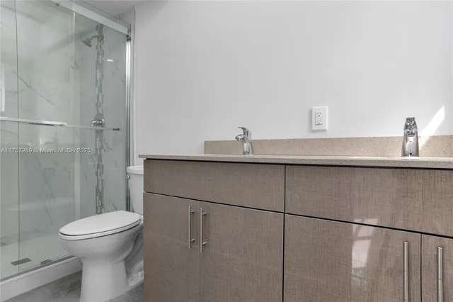 a bathroom with a toilet and a sink