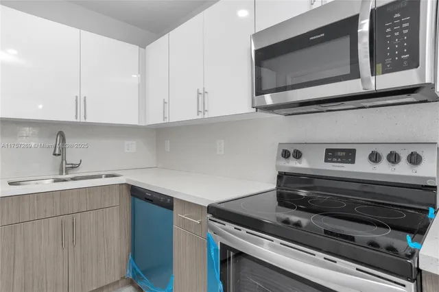 a kitchen with a stove and a microwave