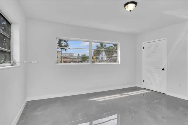 an empty room with windows