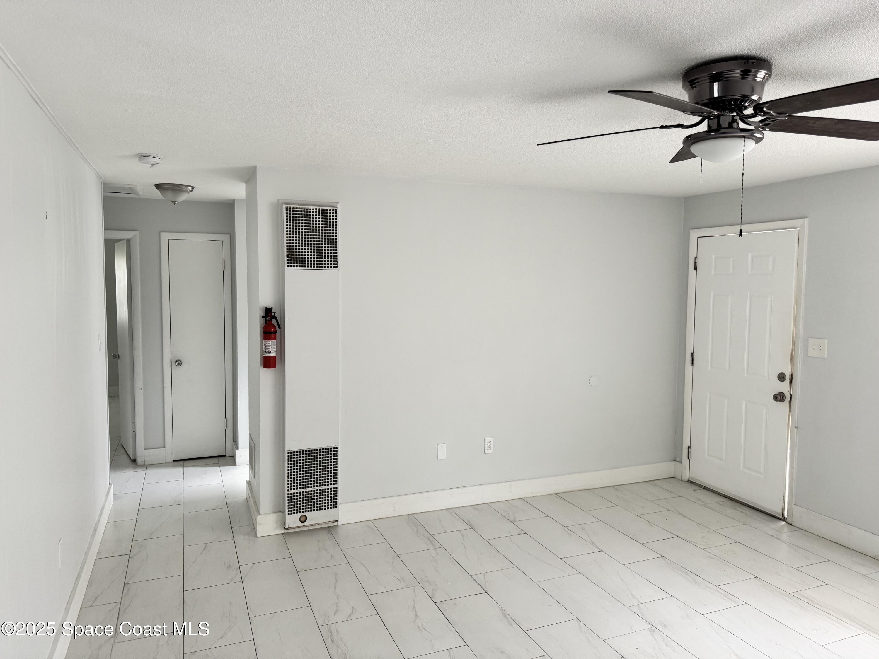 116 E Avenue Melbourne, FL 32901 - Photo 4 of 9 a view of an empty room and chandelier fan