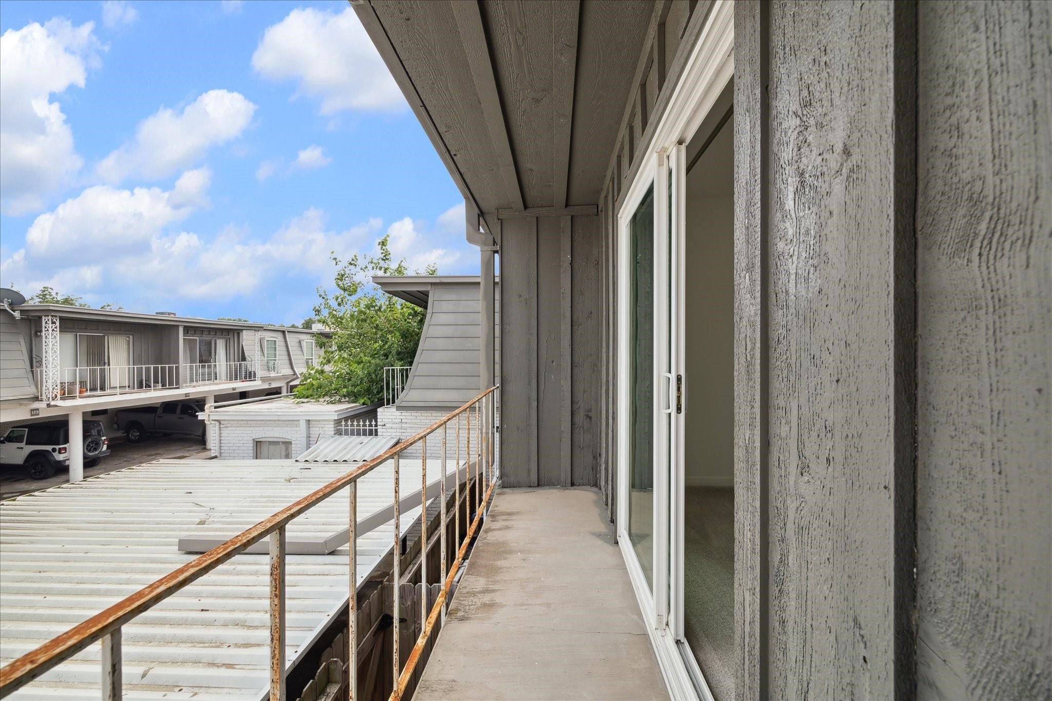 7821 Rue St Cyr Street, Unit 55 Houston, TX 77074 - Photo 8 of 16 Private second-floor balcony overlooking the courtyard.
