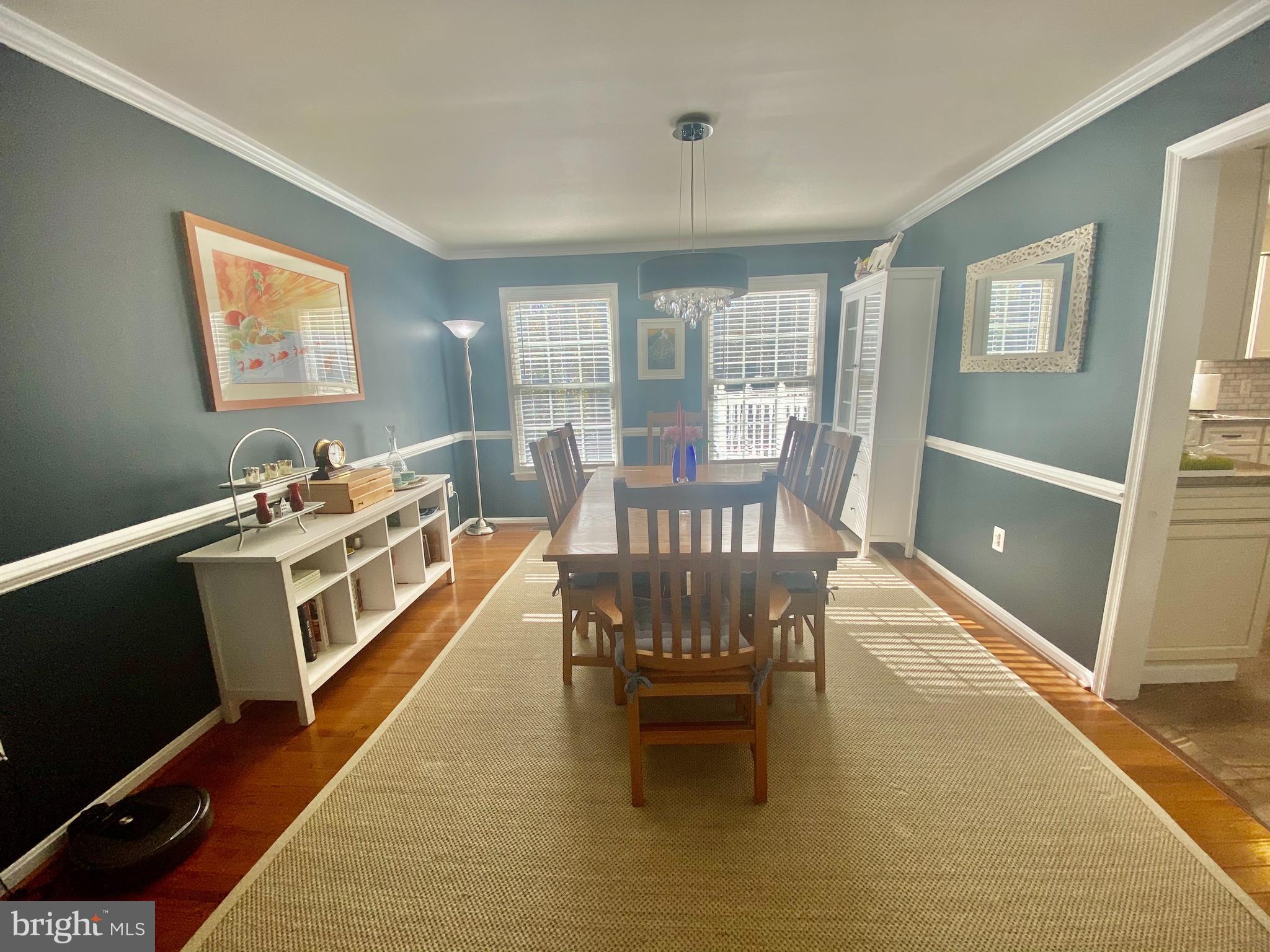 64 Tavern Road Stafford, VA 22554 - Photo 20 of 24 a view of a dining room with furniture a chandelier and wooden floor