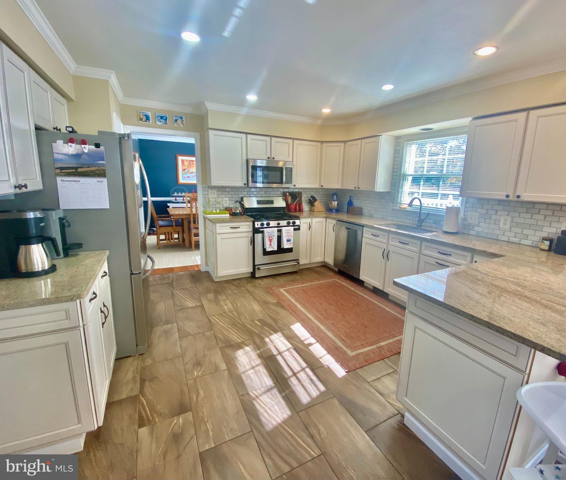 64 Tavern Road Stafford, VA 22554 - Photo 3 of 24 a kitchen with stainless steel appliances lots of counter top space and furniture