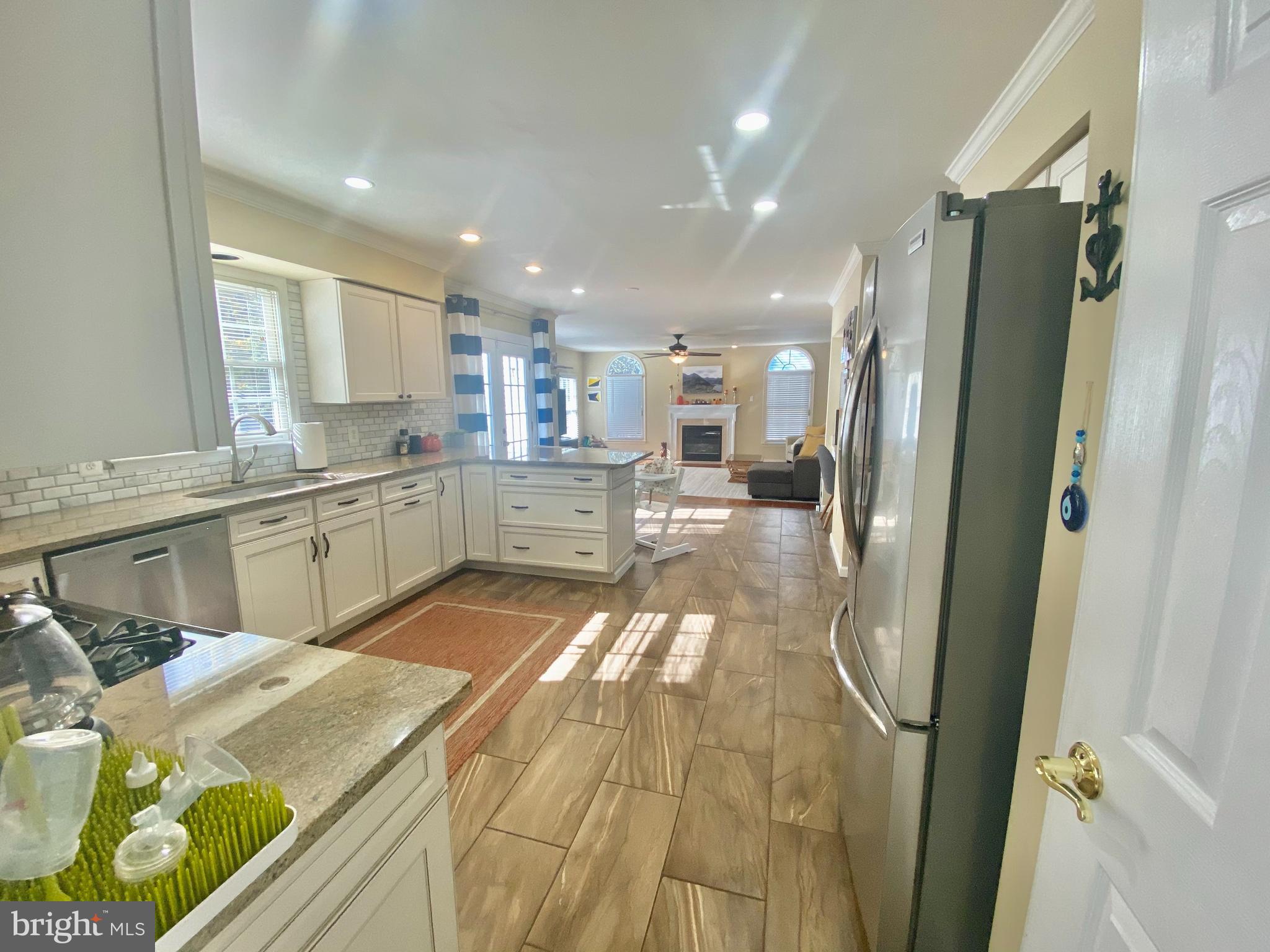 64 Tavern Road Stafford, VA 22554 - Photo 7 of 24 a large kitchen with a sink and stainless steel appliances
