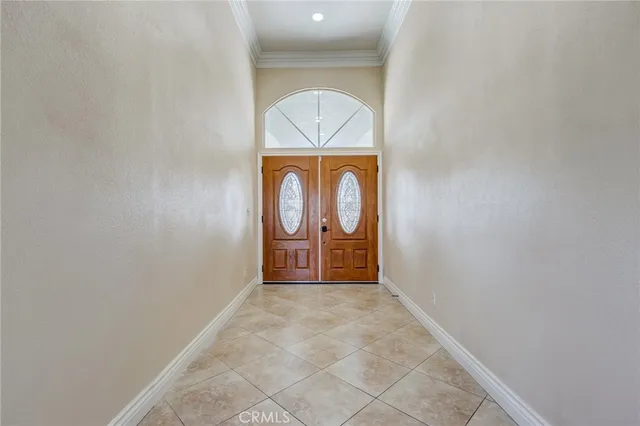 a view of a livingroom with furniture ceiling fan fireplace and windows