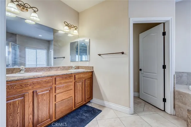 an empty room with fan and windows