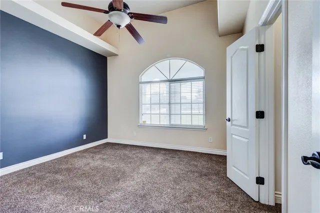 a kitchen with stainless steel appliances kitchen island granite countertop a refrigerator a stove and a sink