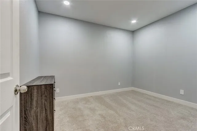 a view of a street with a building in the background