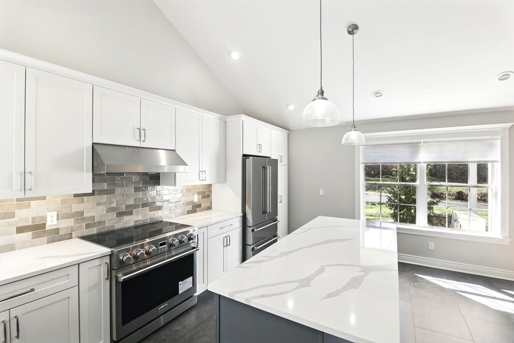 5 Bennett Road Hampden, MA 01036 - Photo 13 of 42 a kitchen with stainless steel appliances white cabinets and a stove