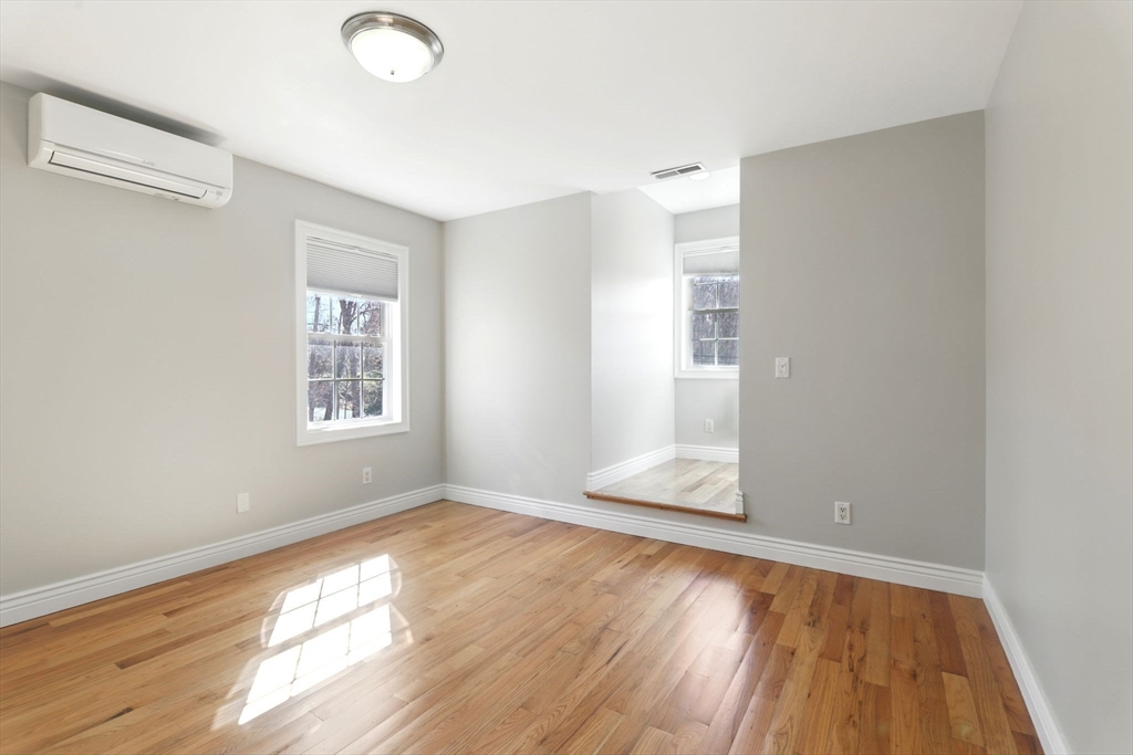5 Bennett Road Hampden, MA 01036 - Photo 27 of 42 an empty room with wooden floor and windows