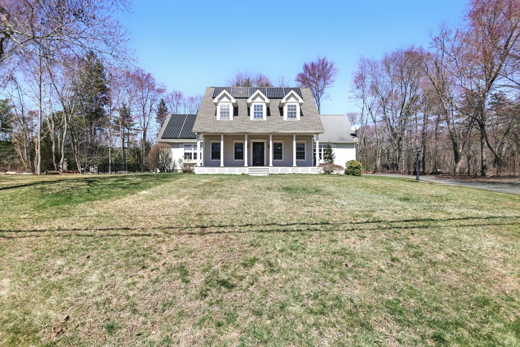 5 Bennett Road Hampden, MA 01036 - Photo 3 of 42 a front view of a house with a garden