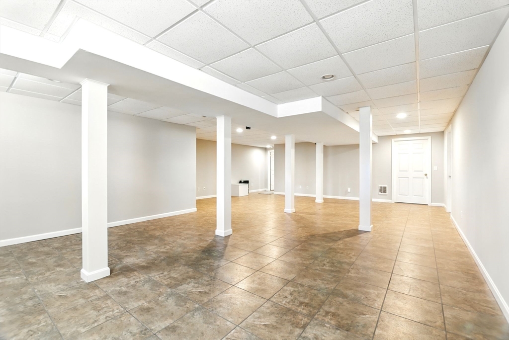 5 Bennett Road Hampden, MA 01036 - Photo 32 of 42 a view of a hallway with a chandelier