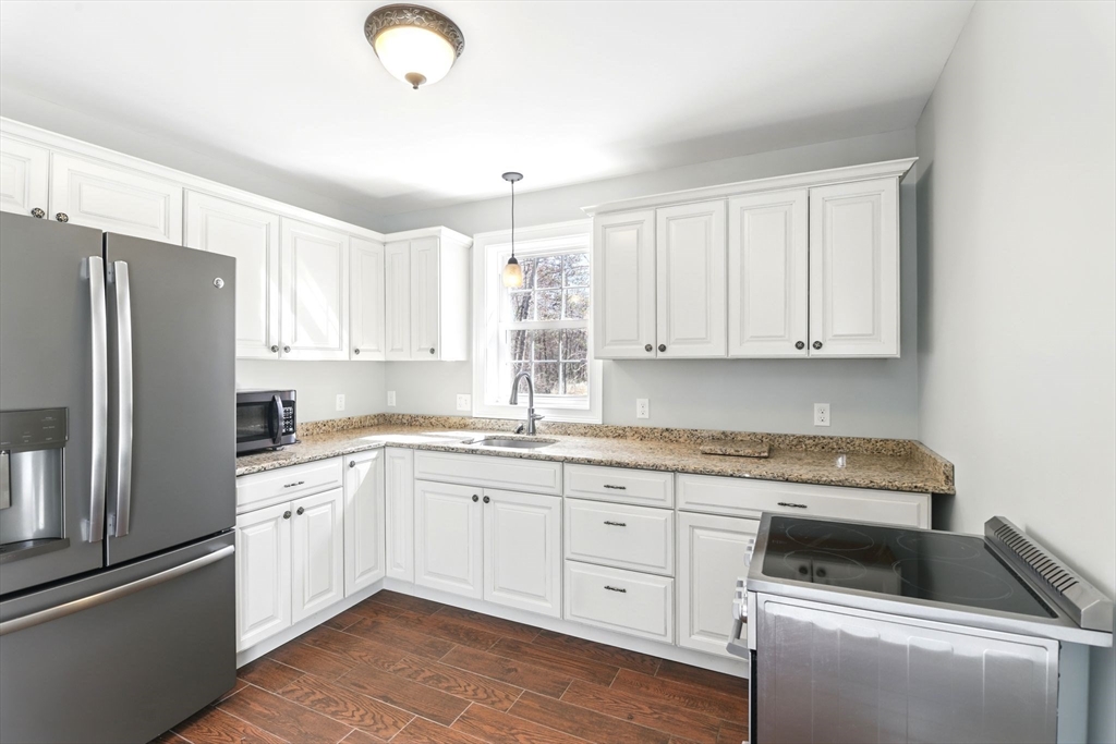 5 Bennett Road Hampden, MA 01036 - Photo 36 of 42 a kitchen with granite countertop a sink stainless steel appliances and cabinets