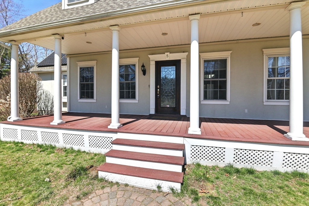 5 Bennett Road Hampden, MA 01036 - Photo 4 of 42 a front view of a house with a garden