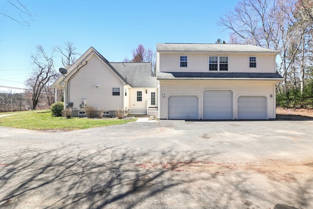 5 Bennett Road Hampden, MA 01036 - Photo 41 of 42 a view of a house with a yard and garage