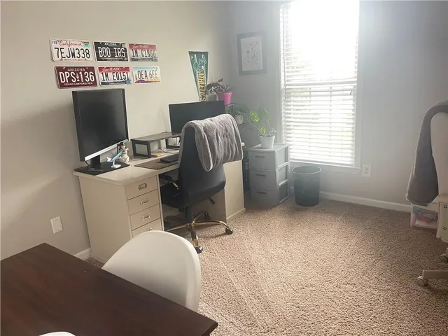 a workspace with furniture and window