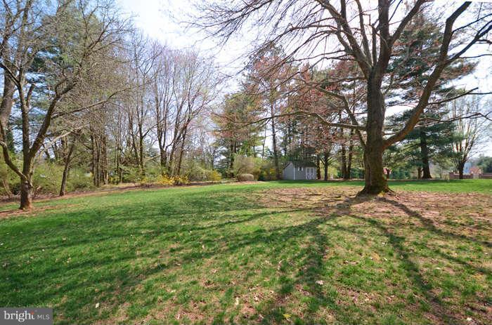 4453 Carroll Manor Road Baldwin, MD 21013 - Photo 27 of 30 a view of outdoor space with deck and trees
