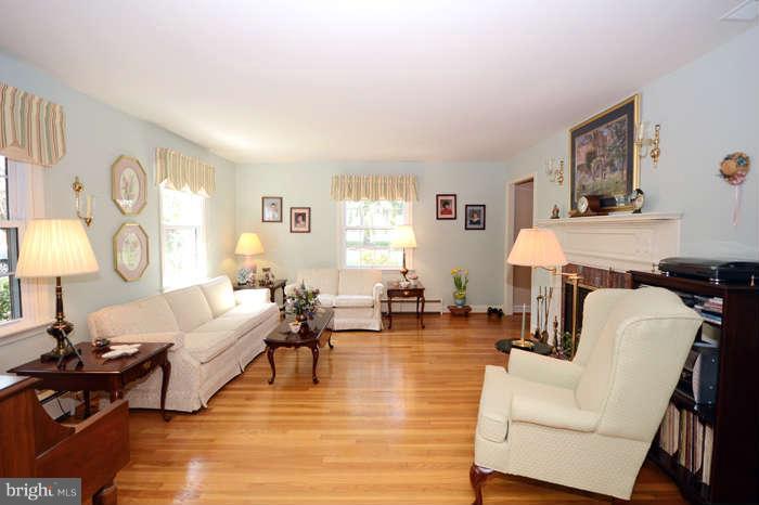 4453 Carroll Manor Road Baldwin, MD 21013 - Photo 6 of 30 a living room with fireplace furniture and a window