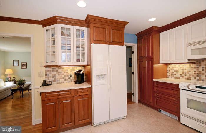 4453 Carroll Manor Road Baldwin, MD 21013 - Photo 9 of 30 a kitchen with stainless steel appliances granite countertop a refrigerator and a stove