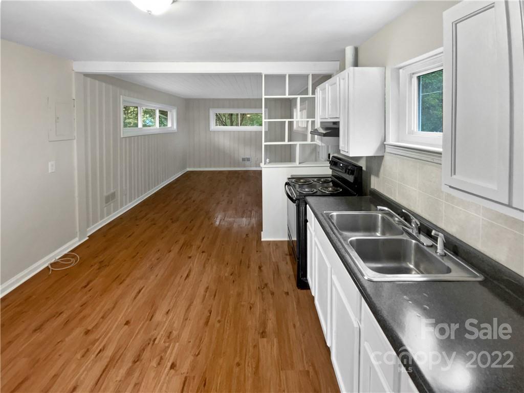 3209 Credenza Road Charlotte, NC 28208 - Photo 11 of 20 a kitchen with a sink and wooden floor